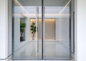 Sleek Glass Doors Opening to a Minimalist Interior Space